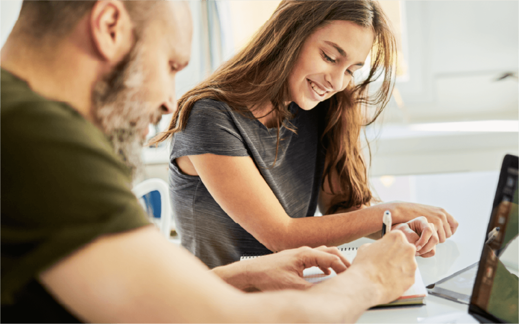 Father helps his daughter learn about finances.